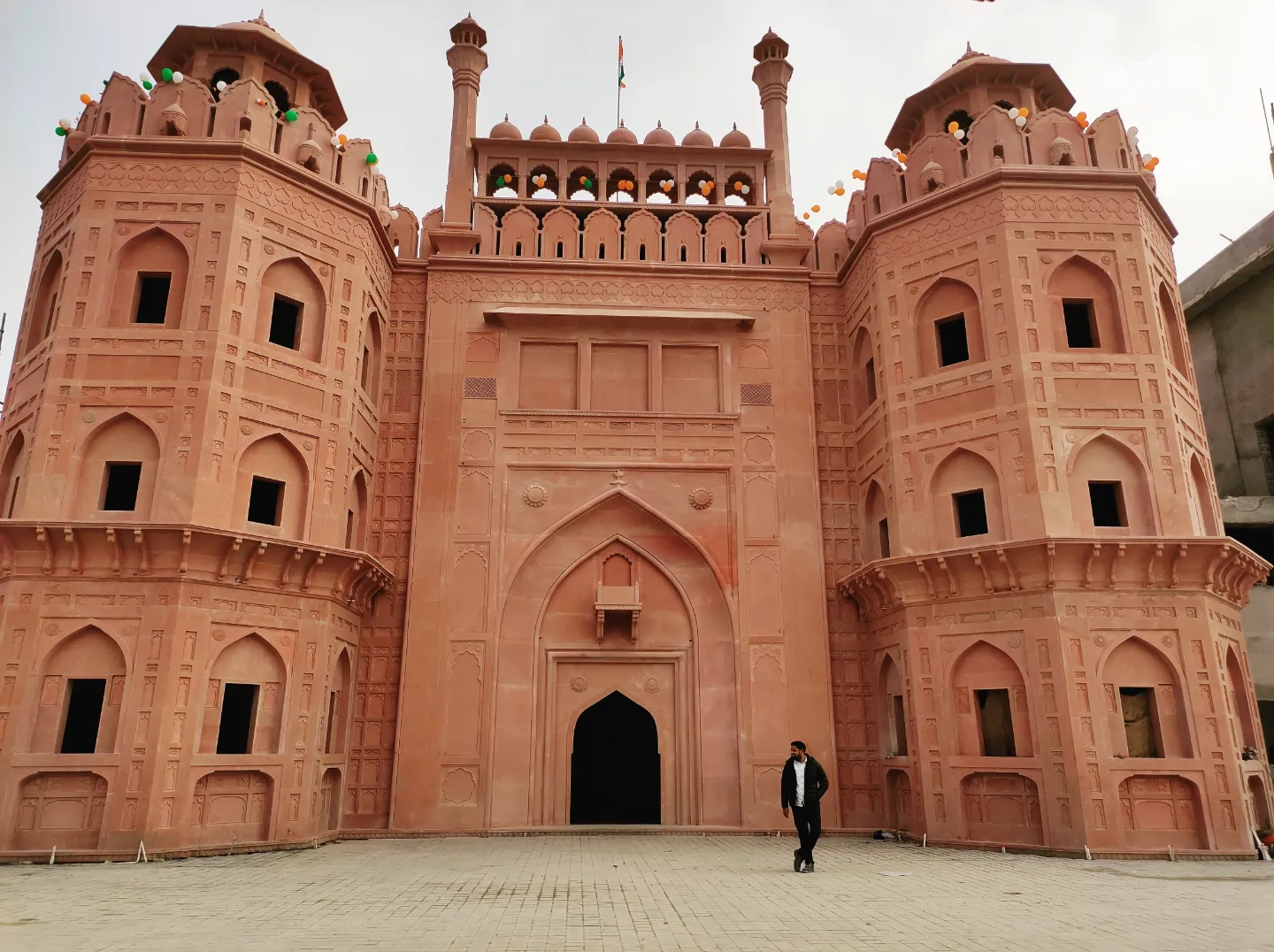 Umang Arts' completed red sandstone monument gate, decorated for Republic Day