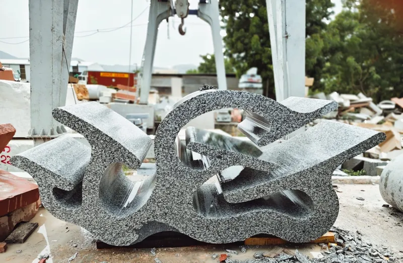 Abstract granite sculpture shaped on CNC