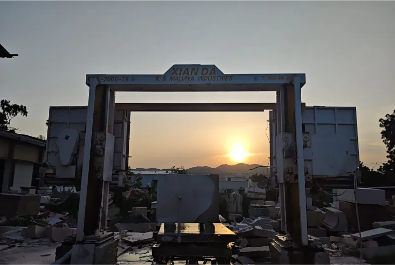 CNC wire saw gantry at sunrise