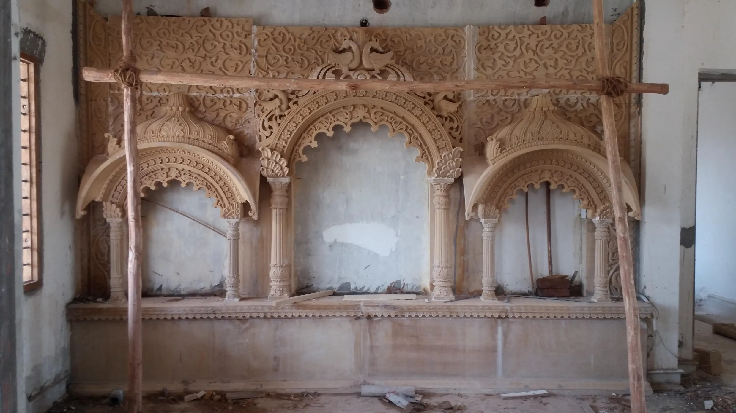 Hand-carved sandstone arches and niche