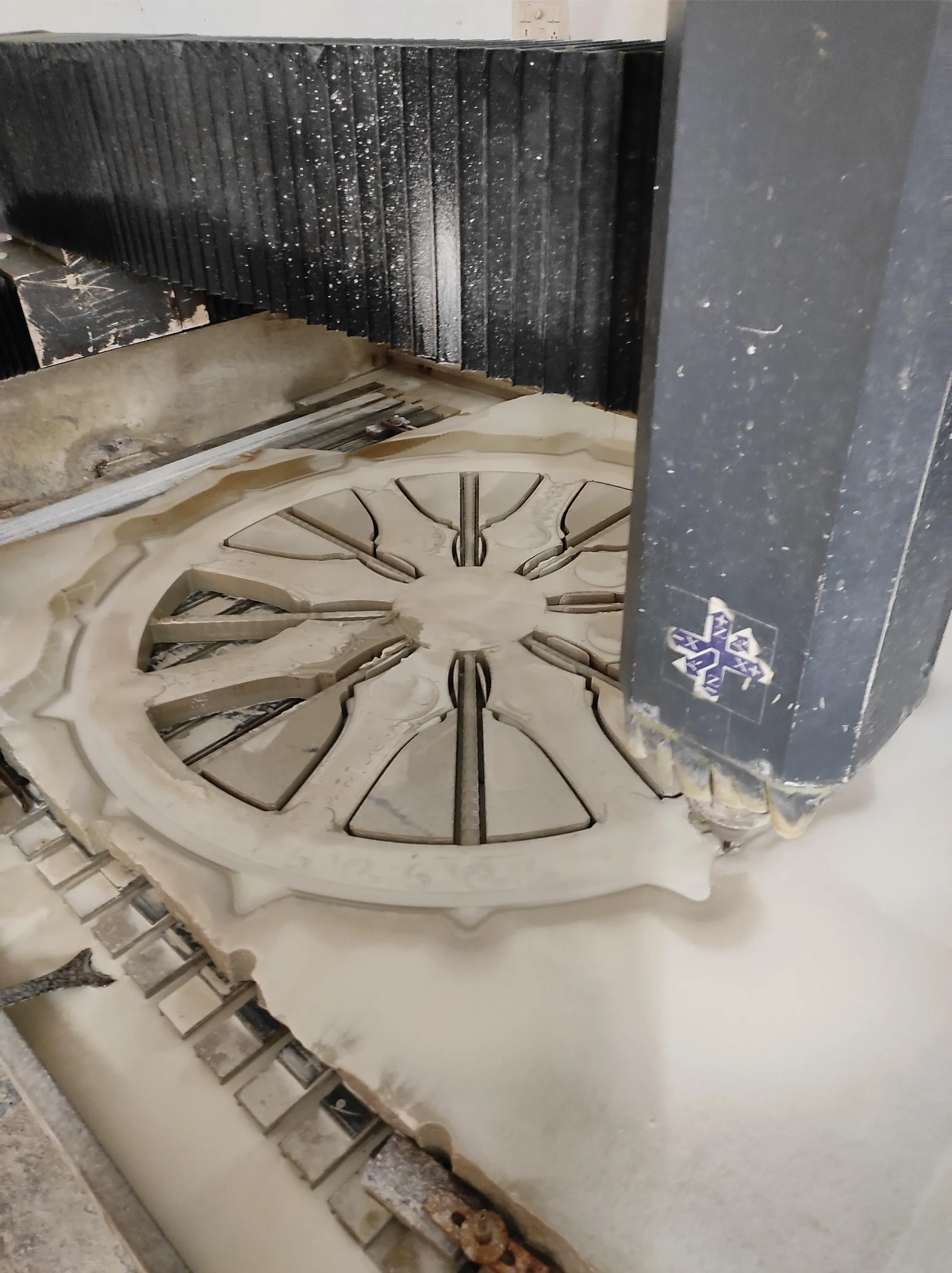 Circular carved stone medallion in progress