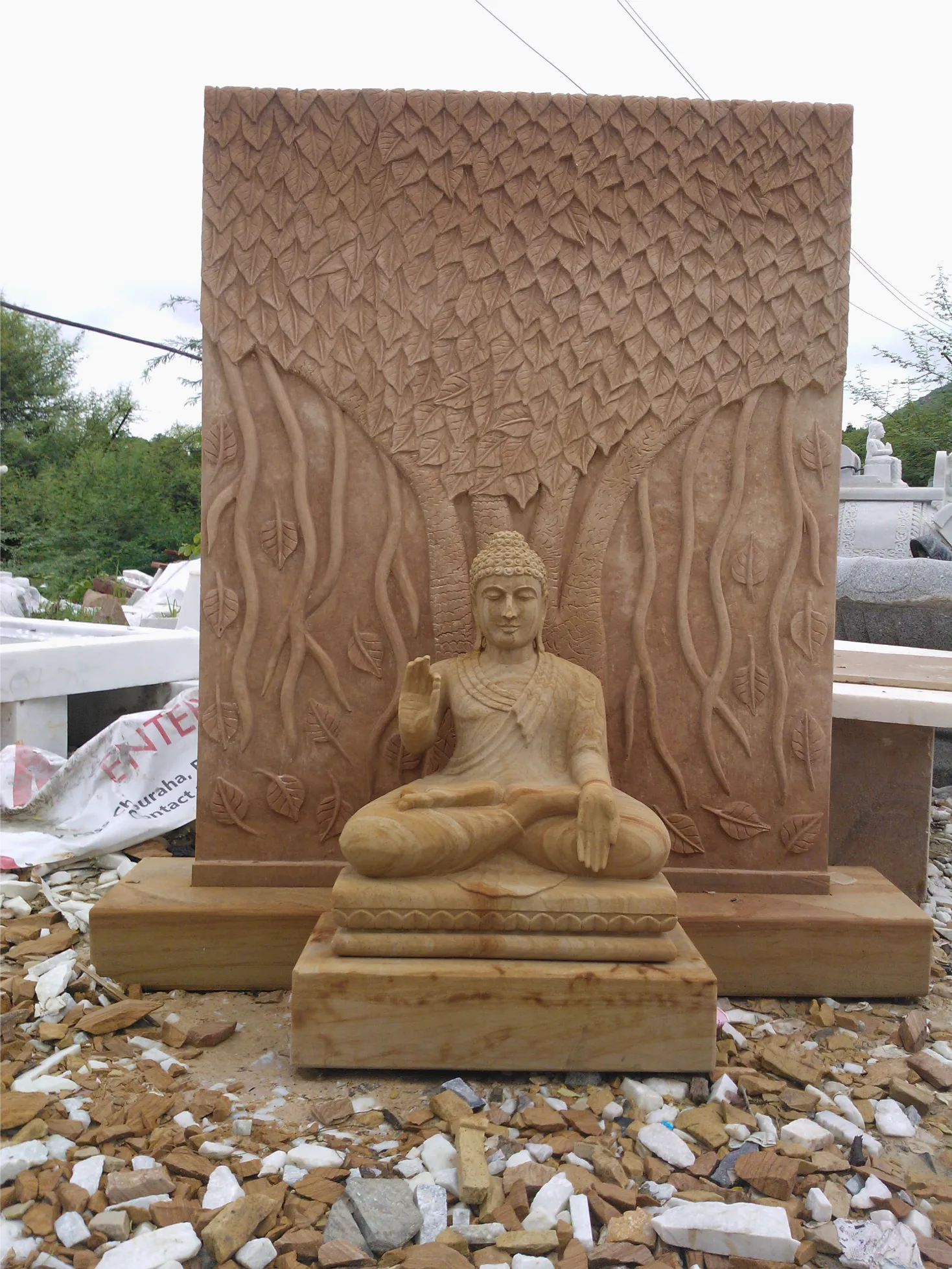 Buddha carved in sandstone relief