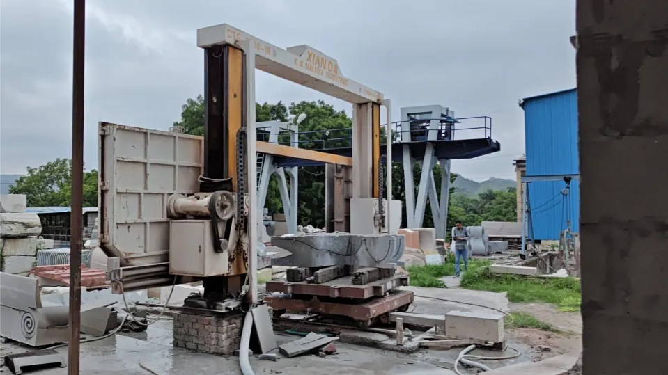 Outdoor CNC wire saw gantry with a stone block