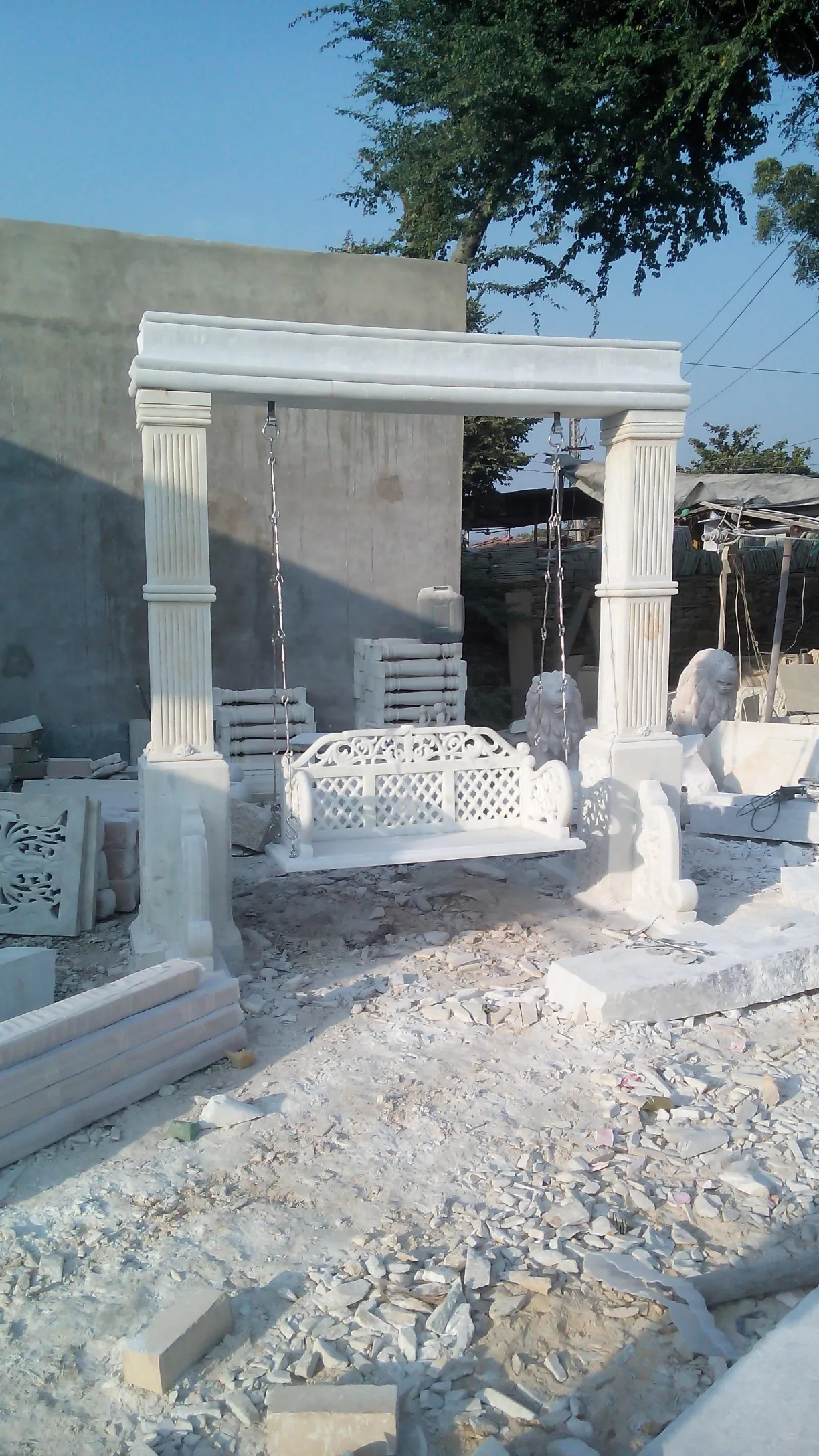 Carved marble garden swing