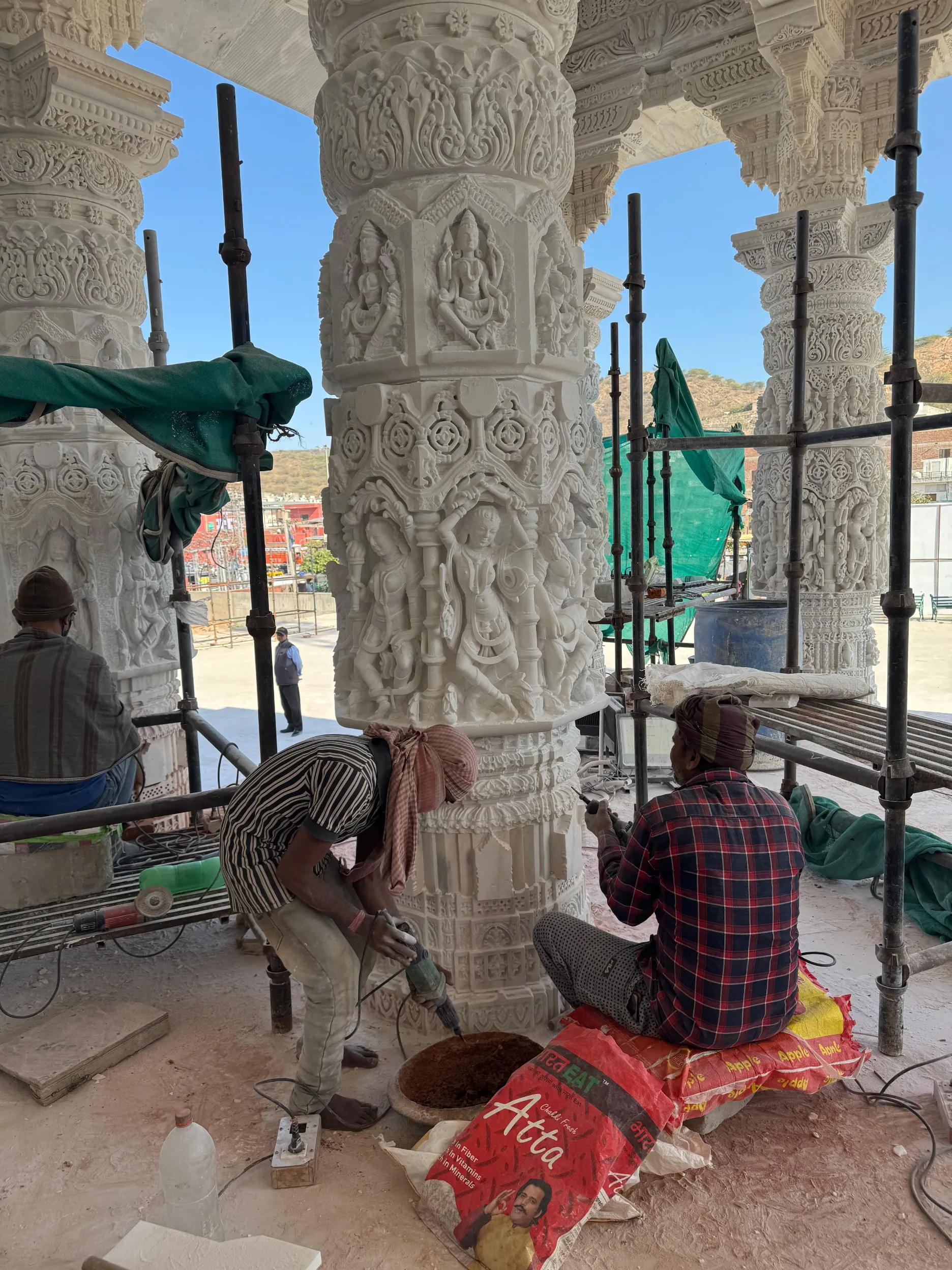 Carved red sandstone temple pillars