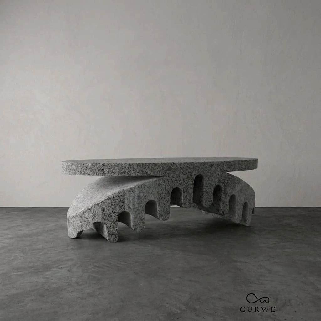 Granite table with a carved arched base