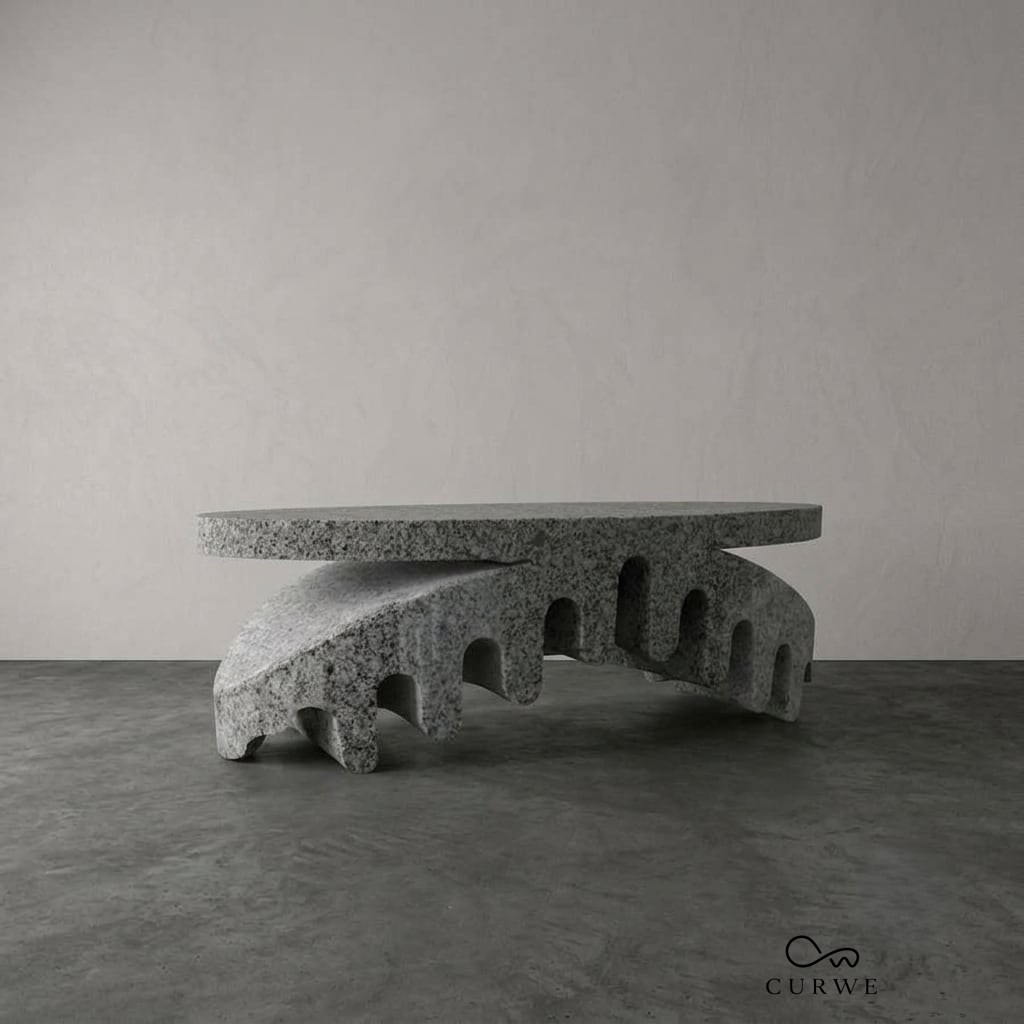 Granite table with a carved arched base