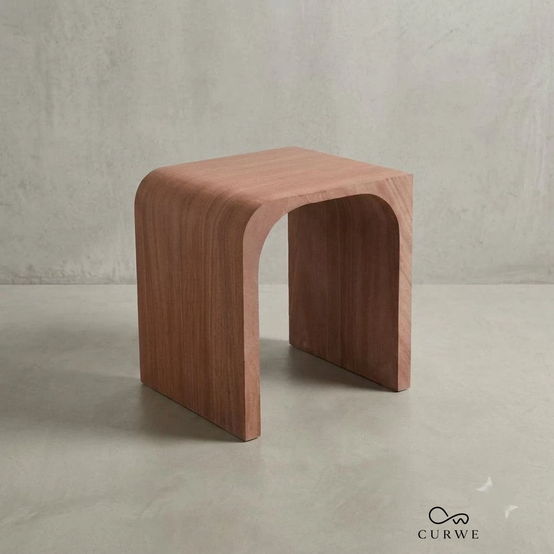 Red sandstone stool with a smooth curved profile