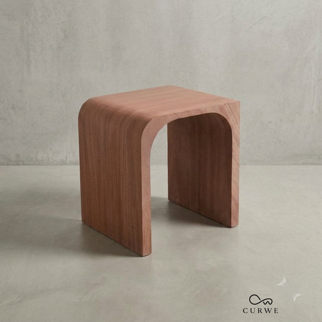 Red sandstone stool with a smooth curved profile