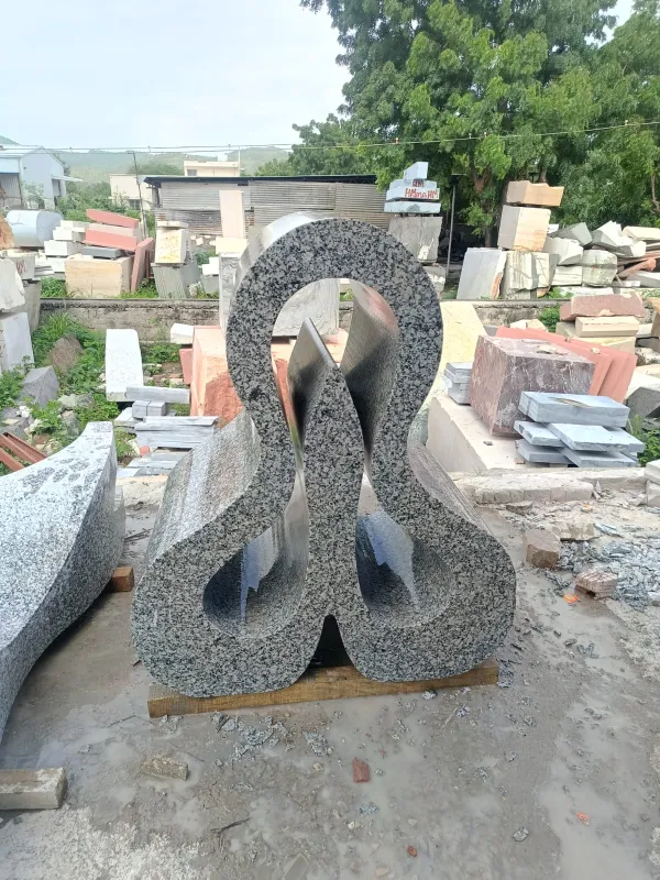 Abstract looping granite sculpture
