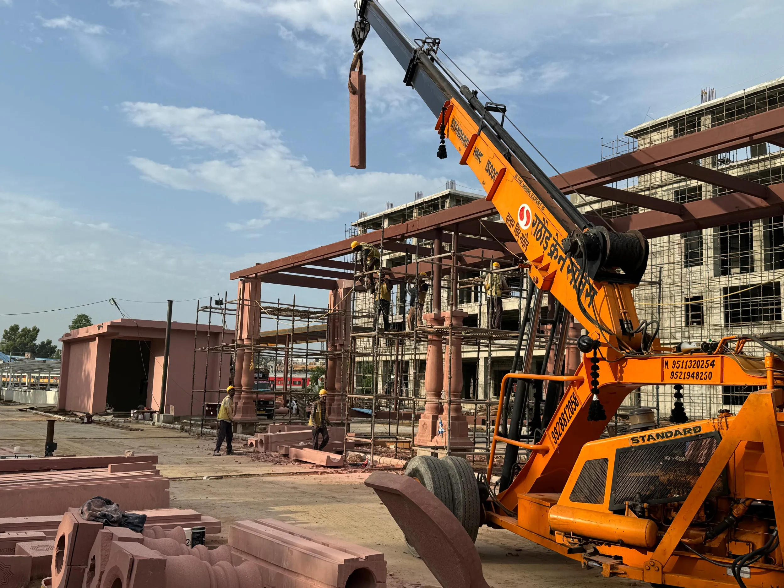 Crane lifting sandstone pillars for the canopy – Jaipur Junction Redevelopment, Jaipur