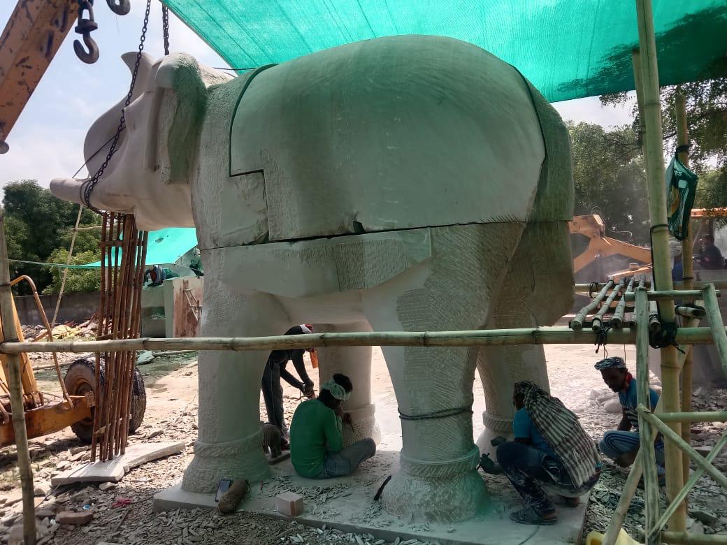 Artisans finishing a stone elephant sculpture on site – Kota Riverfront, Kota