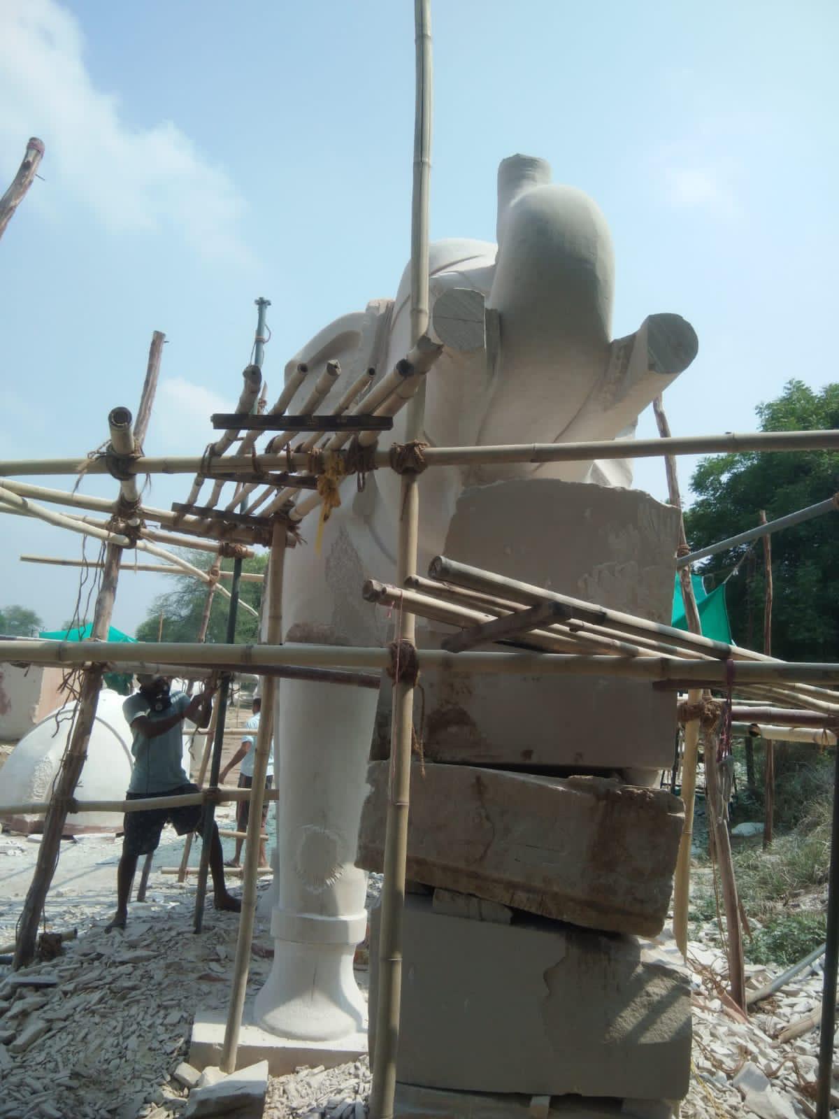 Marble elephant with raised trunk being assembled on scaffolding – Kota Riverfront, Kota