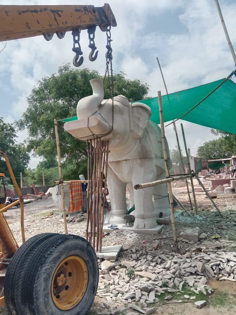 Marble elephant with raised trunk being finished on site – Kota Riverfront, Kota