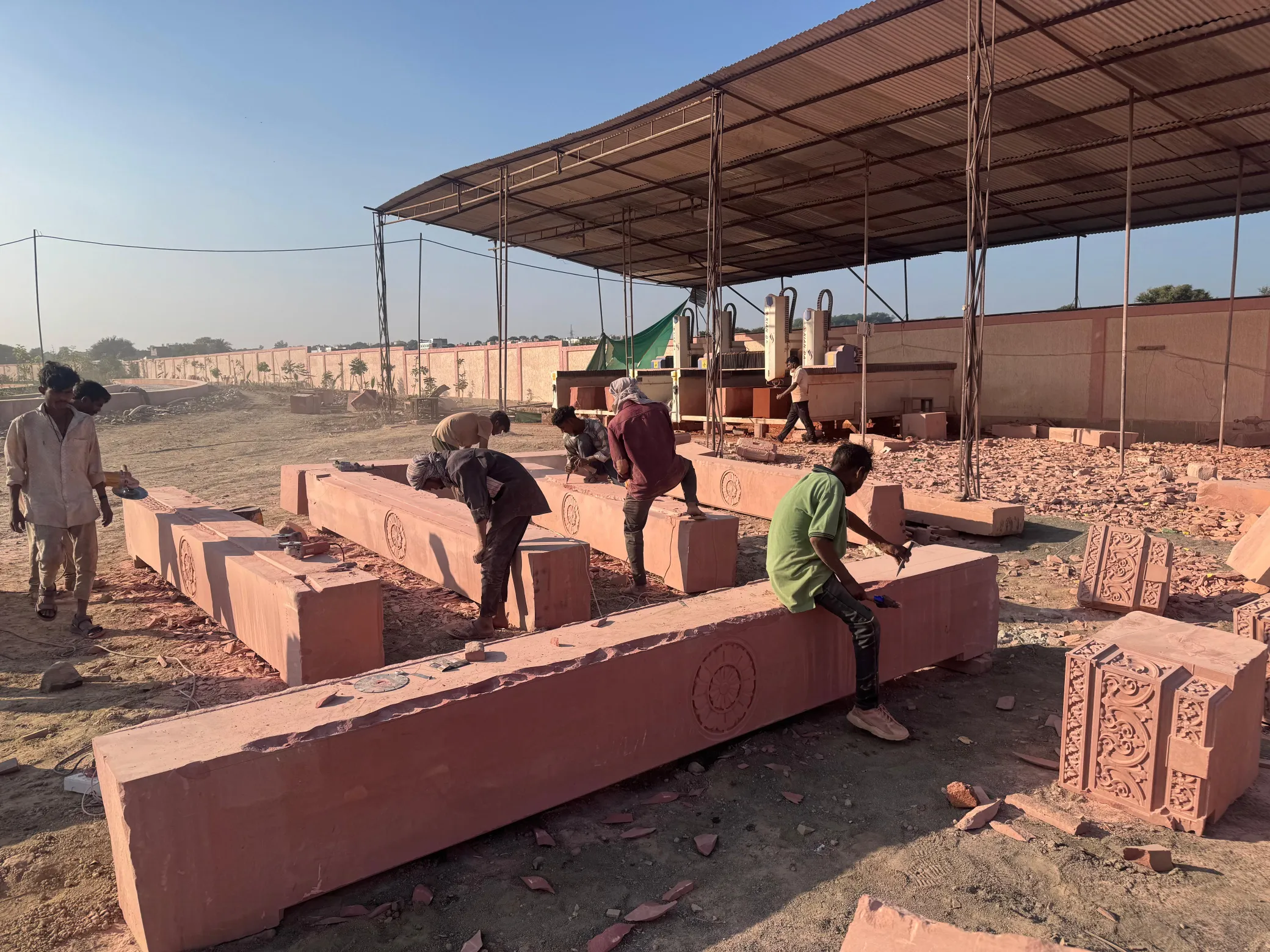 Sandstone plinth blocks placed under shade – Sant Ravidas Temple, Sagar