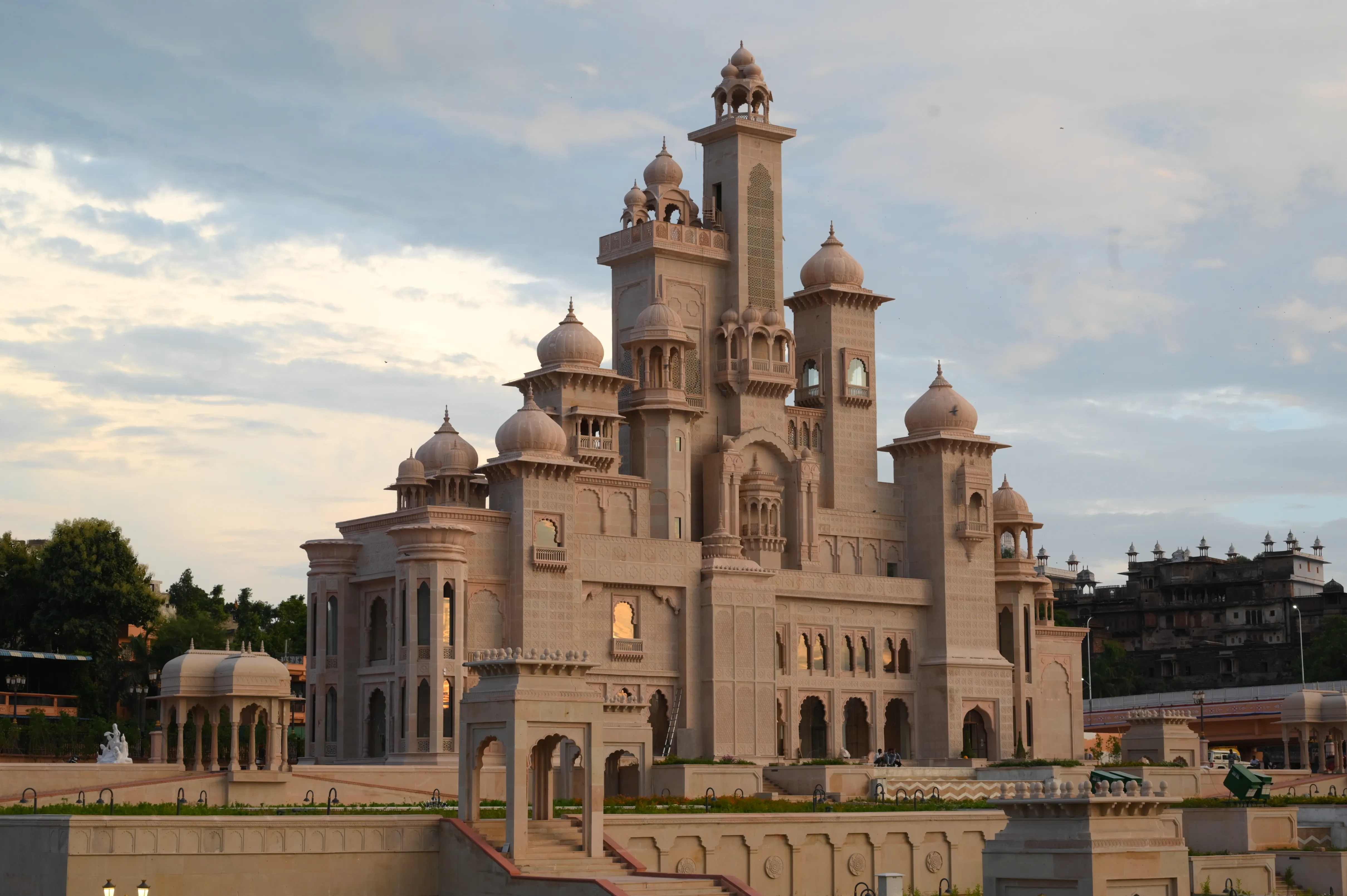 Carved stone facade with domes, jharokhas and ornamental detailing