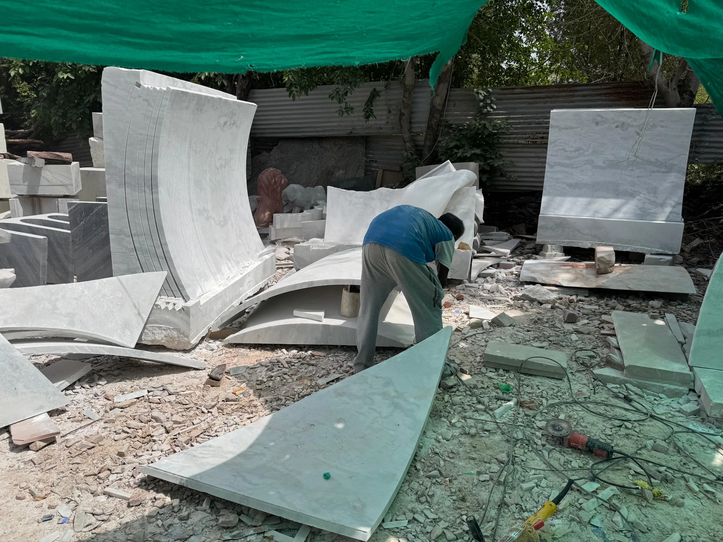 Curved marble dome segments being finished in the workshop