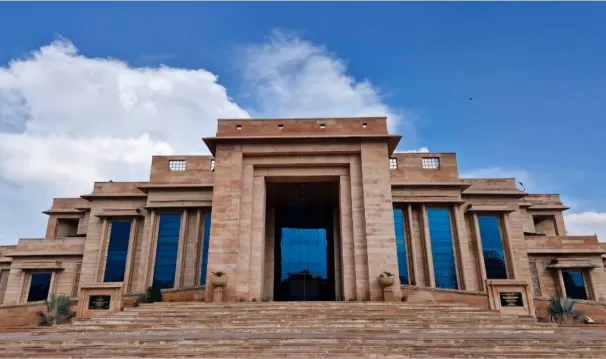 Building entrance fully clad in custom-cut sandstone