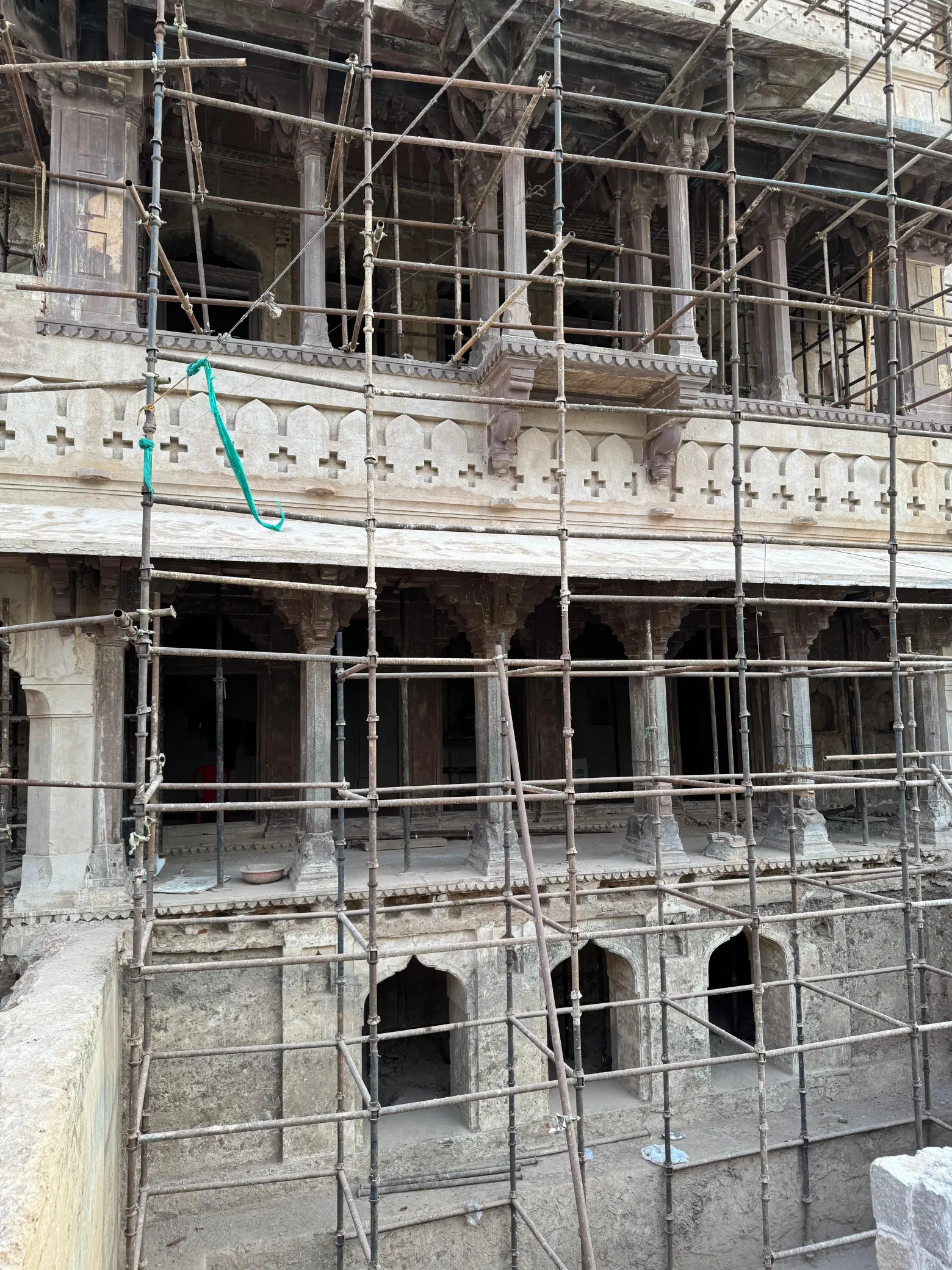 Multi-storey heritage building under scaffolding during stone restoration