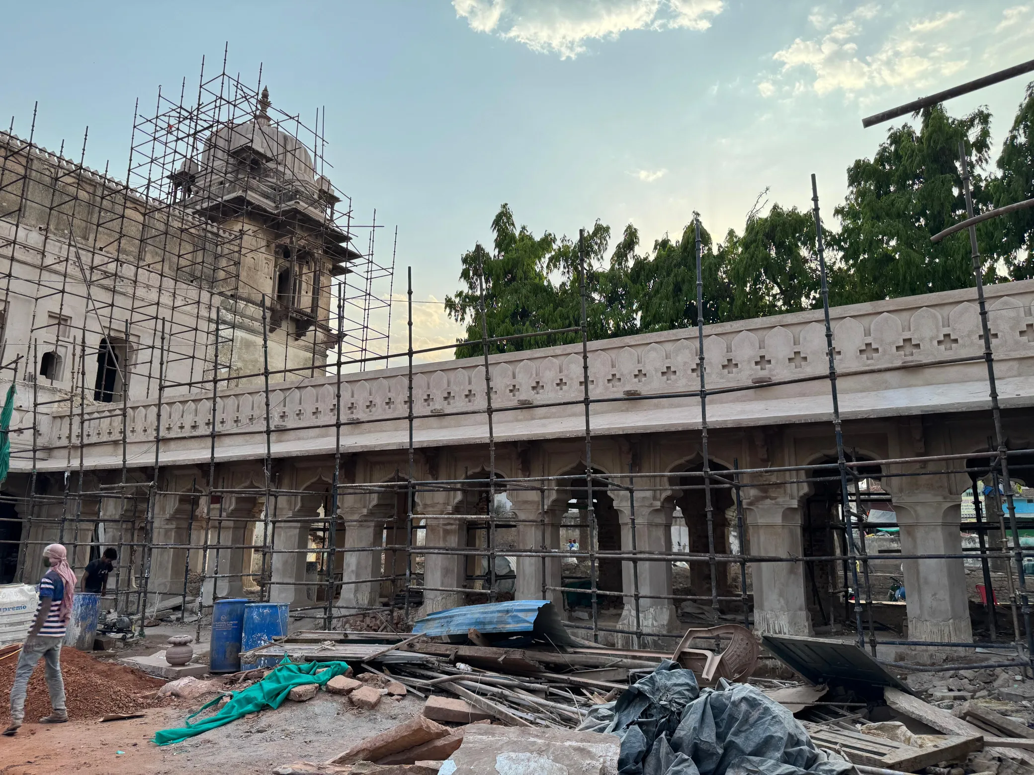 Long colonnaded heritage facade with scaffolding for facade restoration