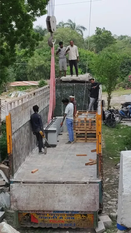 Crated natural stone being loaded onto a truck for dispatch